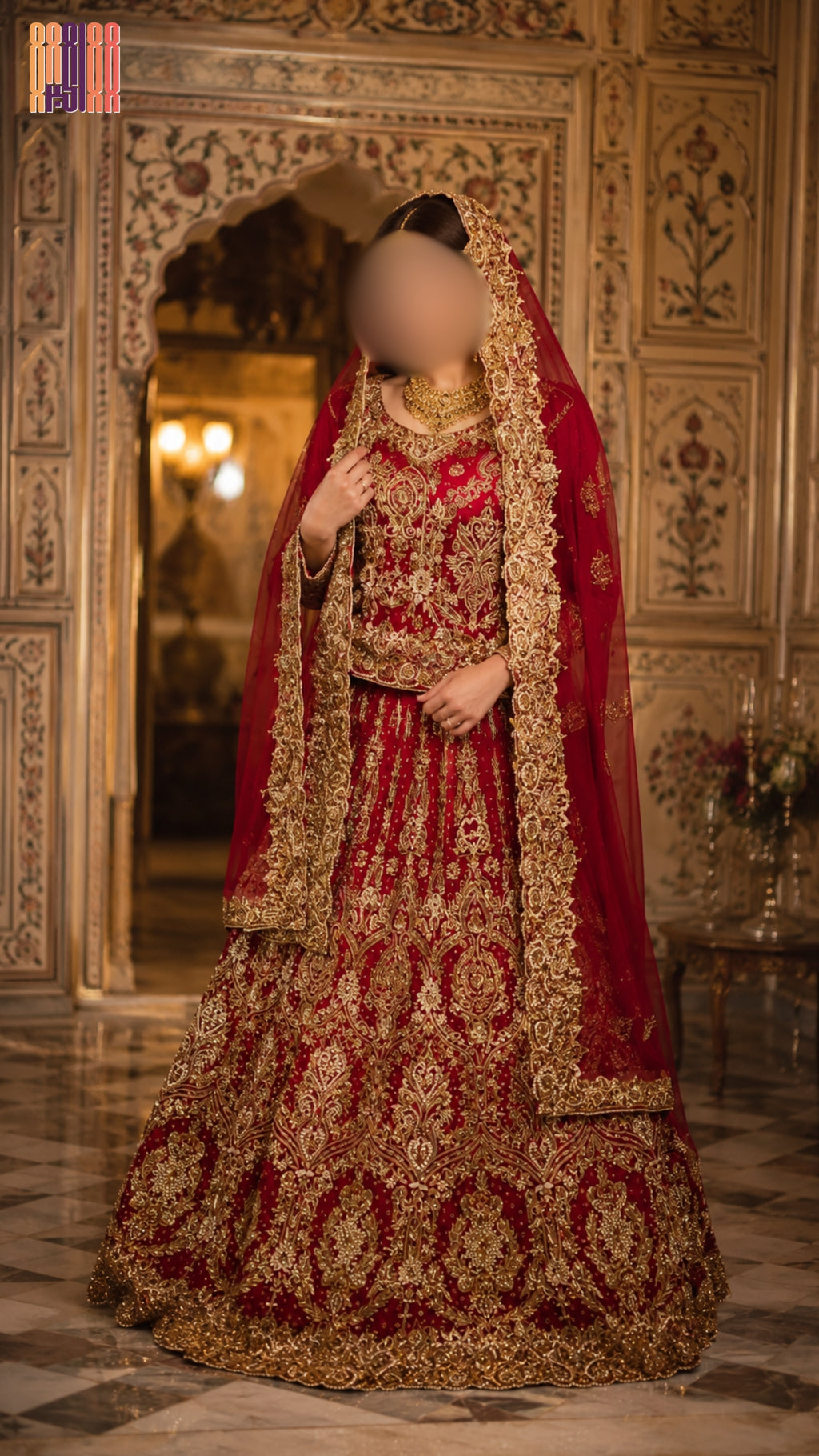 Woman in a traditional red and gold bridal outfit in an ornate room. bridal lehenga pakistani deep anari red full view