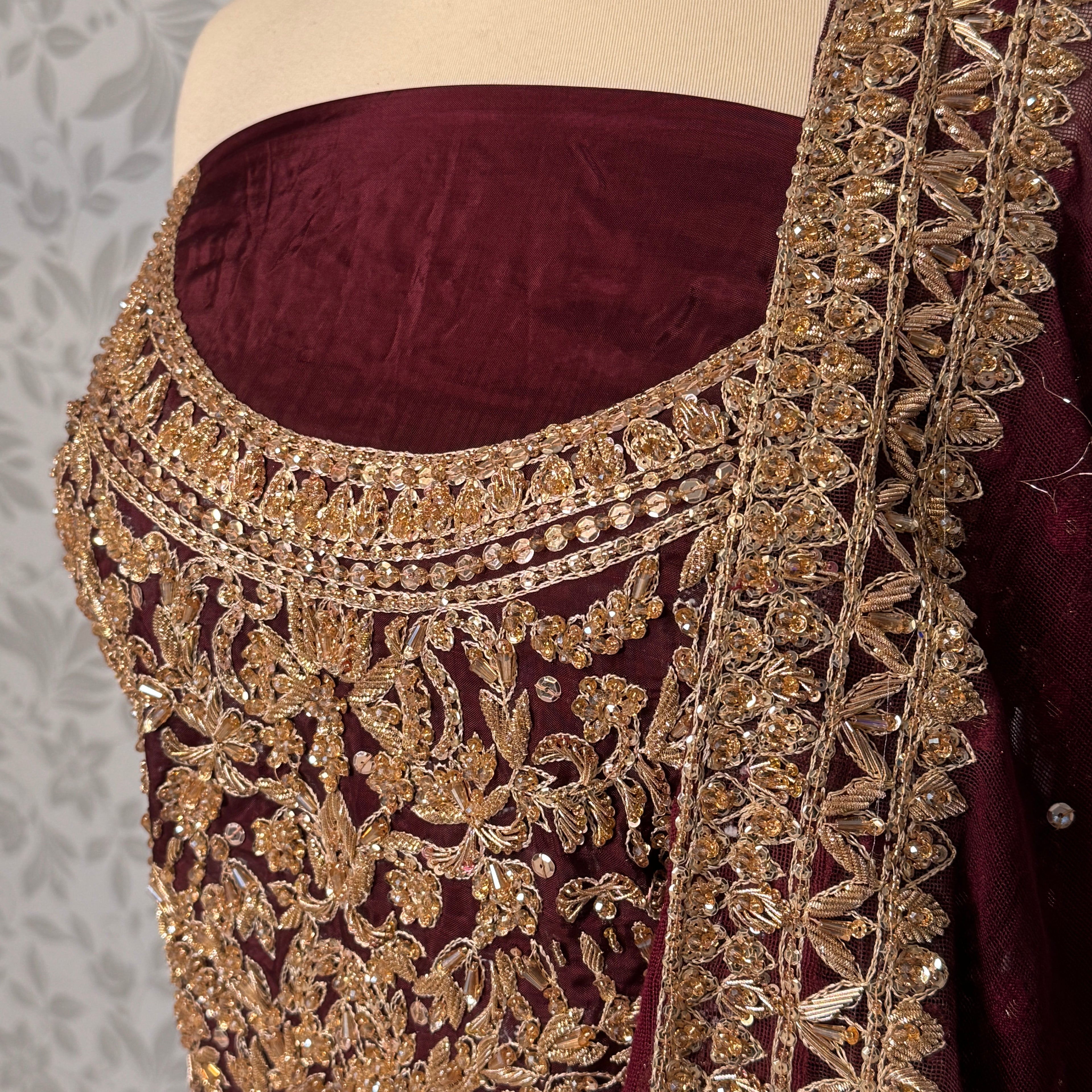 Bridal lehenga Pakistani BL034 choli close up – nakshi jewelry hand work detail on maroon tassel silk fabric
