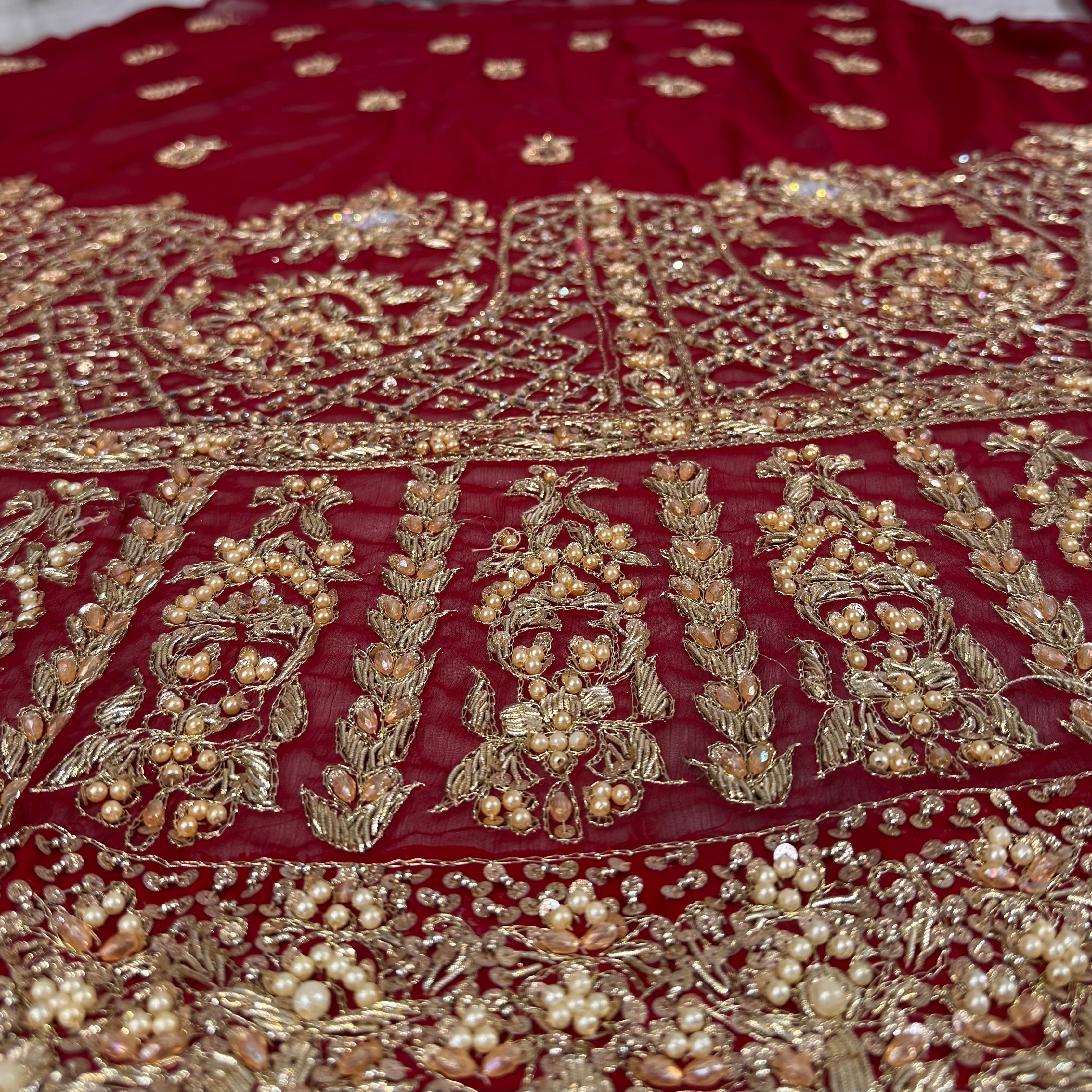 Bridal lehenga hand work BL028 lehenga back view – deep anari red crinkle chiffon with kora dabka and jewelry crystal back embroidery Pakistan

