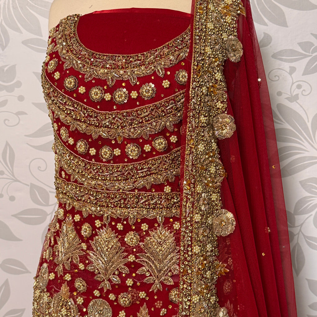 Bridal lehenga Pakistani BL024 shirt close up – nakshi stone pearl kora hand work detail on red bareeze net fabric
