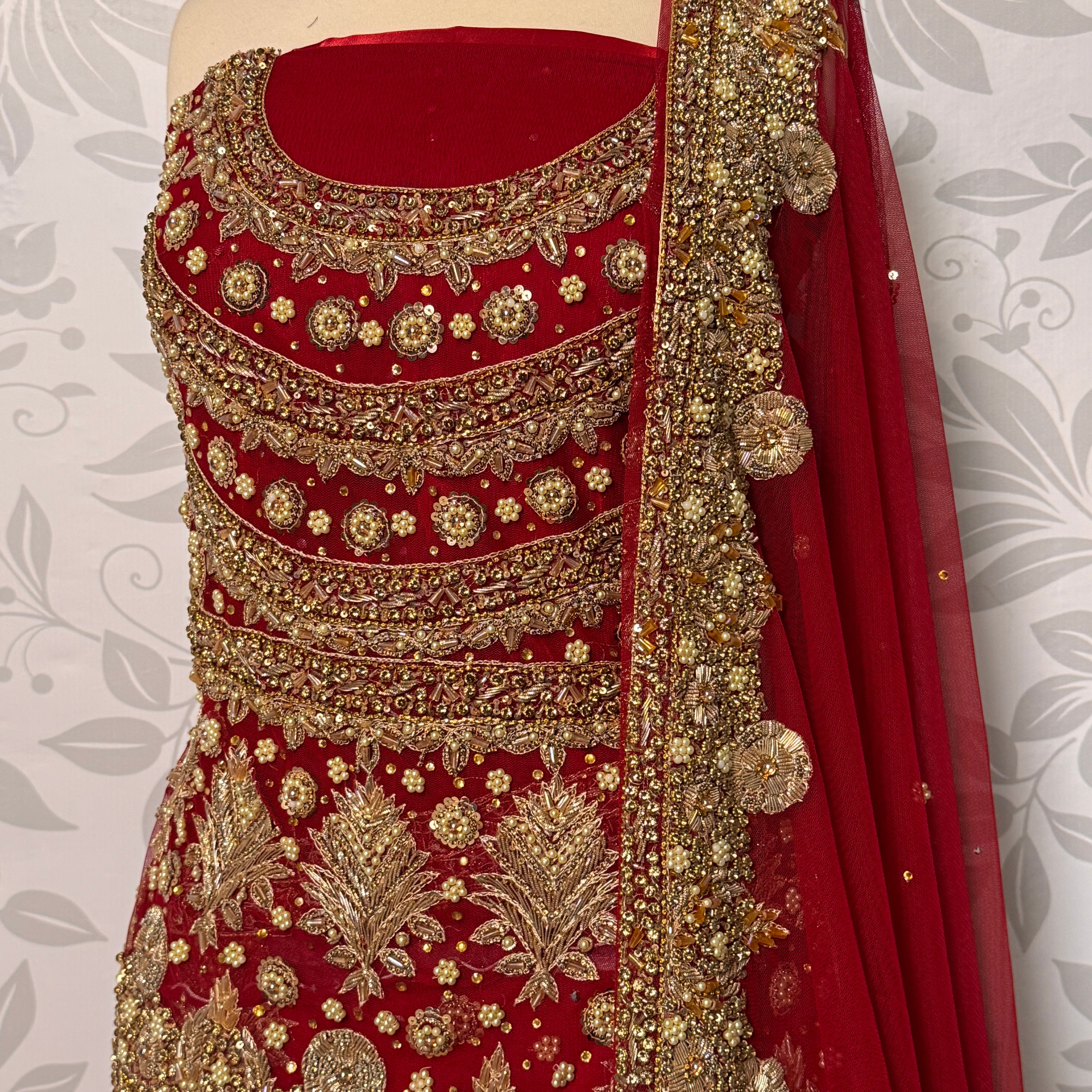 Bridal lehenga Pakistani BL024 shirt close up – nakshi stone pearl kora hand work detail on red bareeze net fabric
