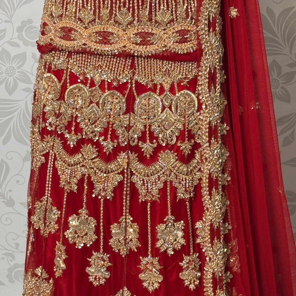 Wedding lehenga hand work BL033 lehenga front view – deep anari red velvet with dabka kora nakshi and jewelry embroidery full skirt Pakistan
