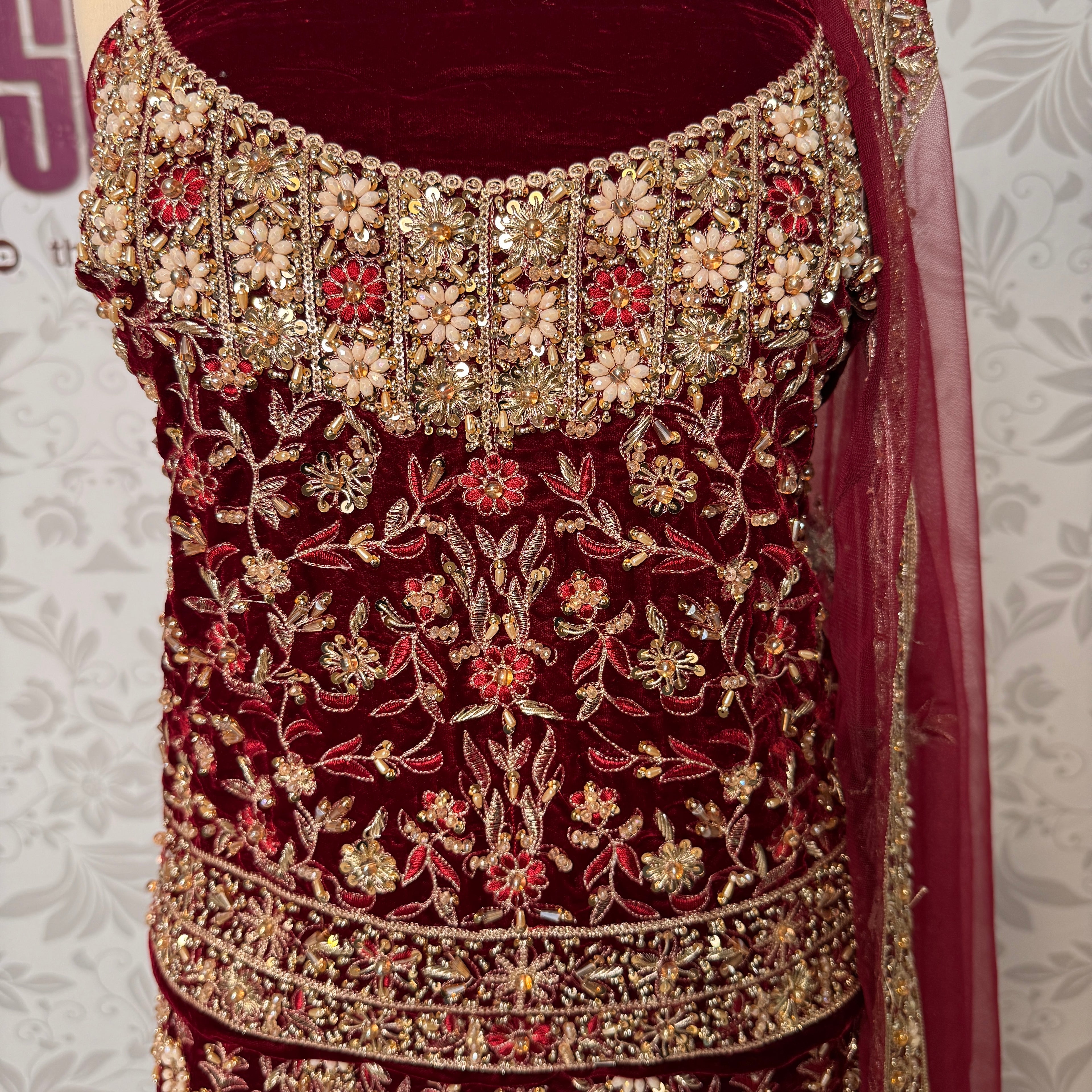 Bridal lehenga Pakistani BL030 shirt close up – kora resham jewelry hand work detail on maroon velvet fabric

