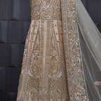Bridal maxi for nikkah BM021 embroidery close up – dabka and jewelry hand work detail on skin gold net fabric
