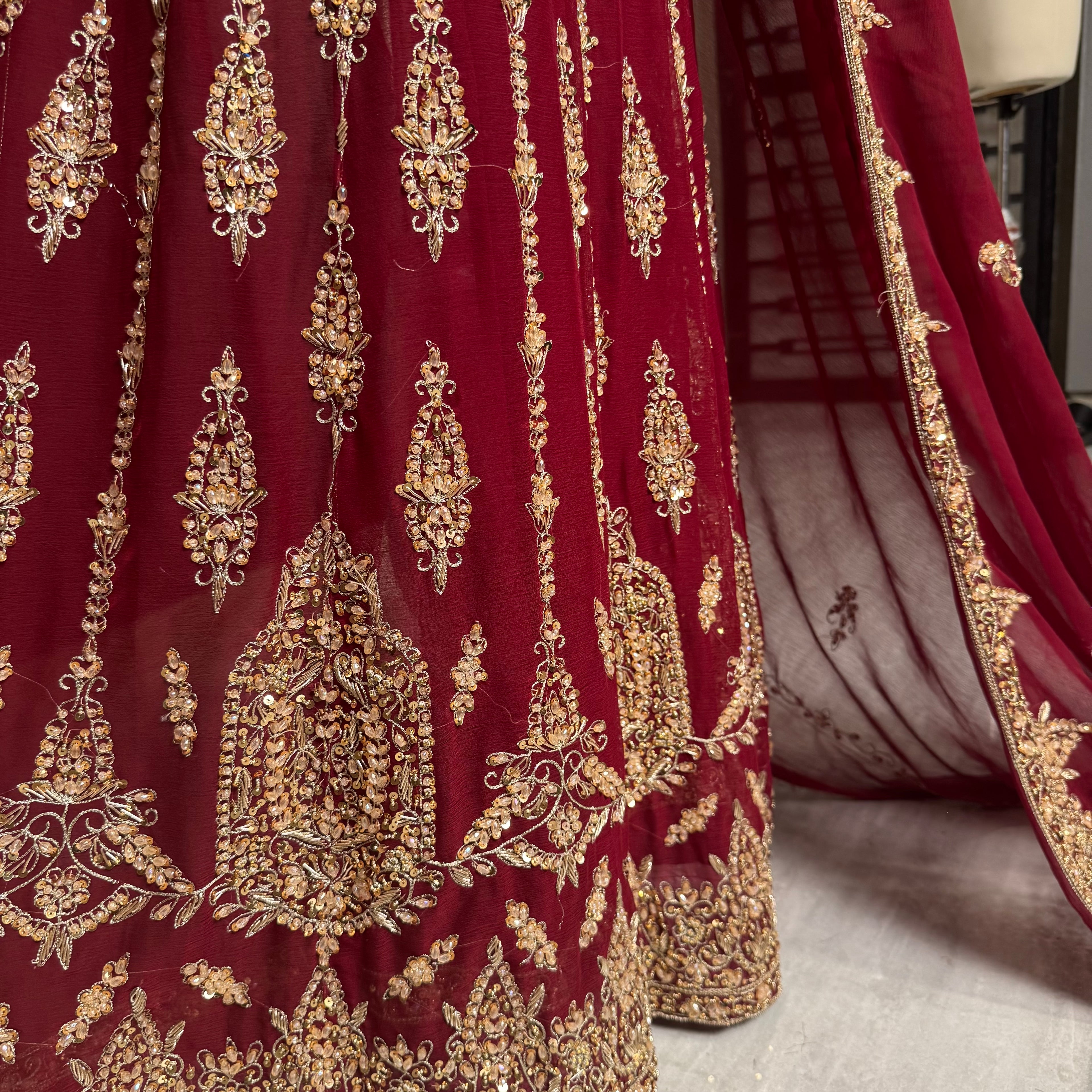 Bridal lehenga pakistani in deep red crinkle chiffon with tilla and kora hand work