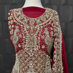 Wedding lehenga hand work close-up showing kora dabka jewelry material embroidery on red chiffon fabric