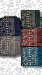 Six folded fabric pieces with ornate metallic embroidery arranged in two columns on a white background with a light gray floral pattern. The fabrics are in dark green, navy blue, charcoal gray, burgundy red, and teal blue.