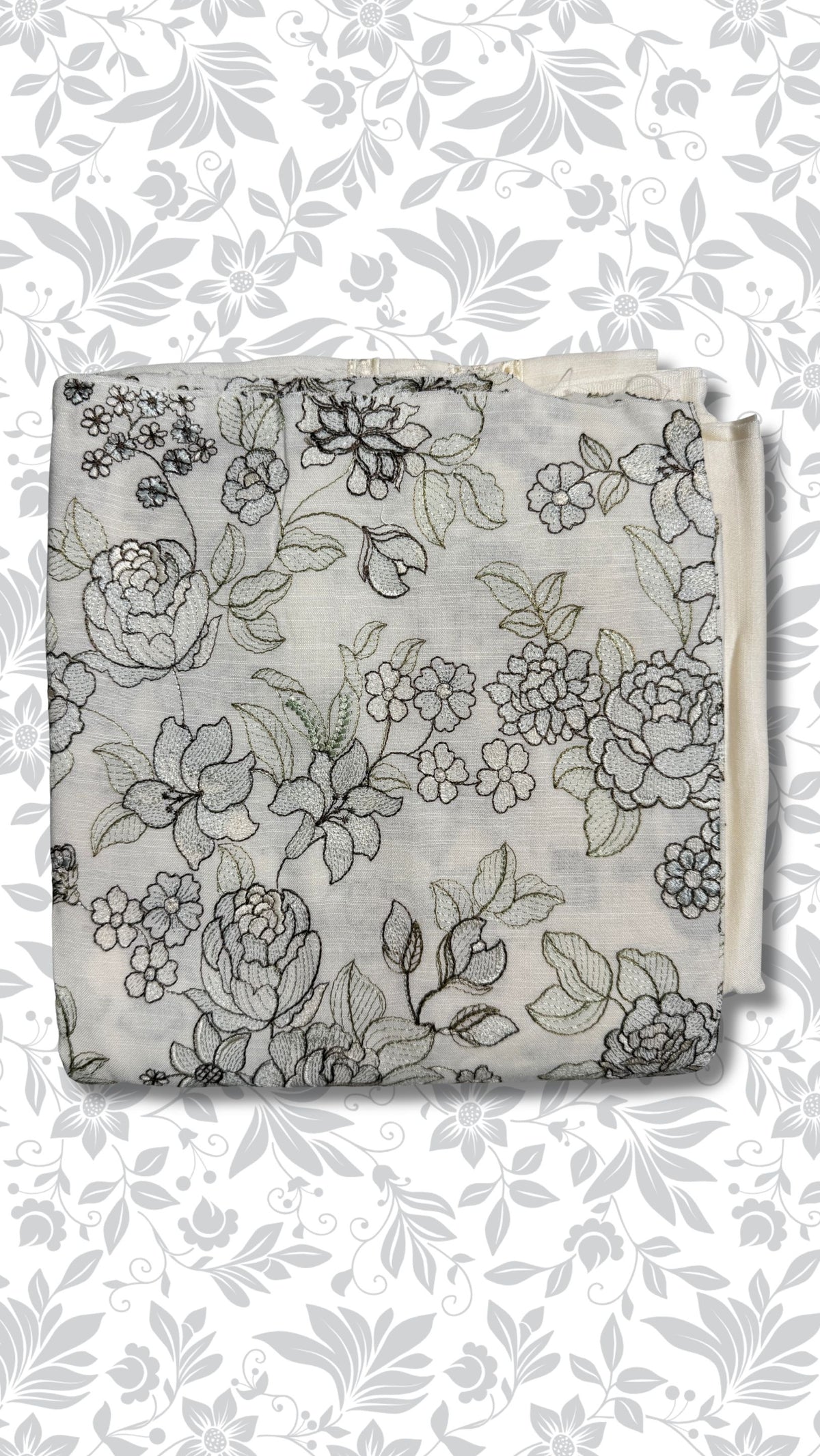 A folded piece of light gray fabric with a black floral line-art pattern, displayed against a white background with a matching gray floral watermark pattern.