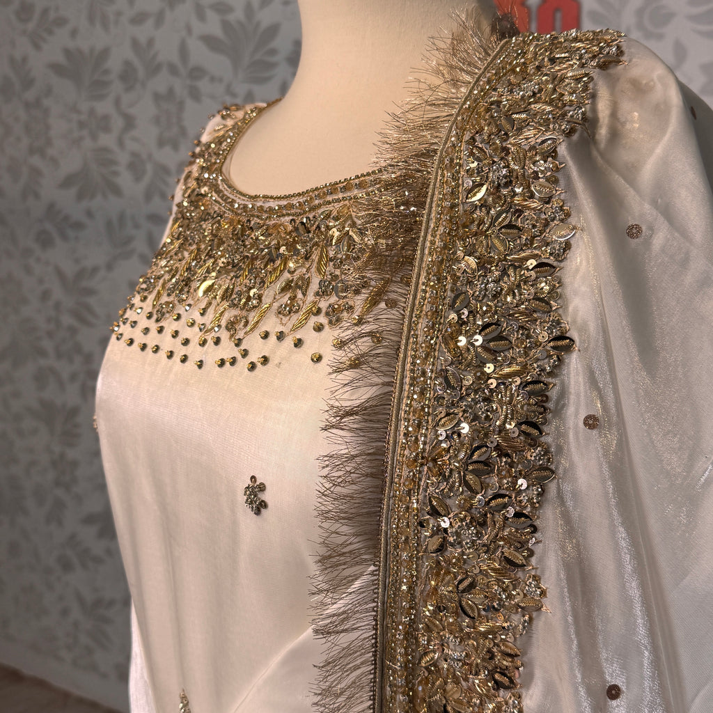Party wear dresses for girl in Pakistan PW032 shirt close up – kora nakshi sequin hand work detail on off-white sheesha silk fabric
