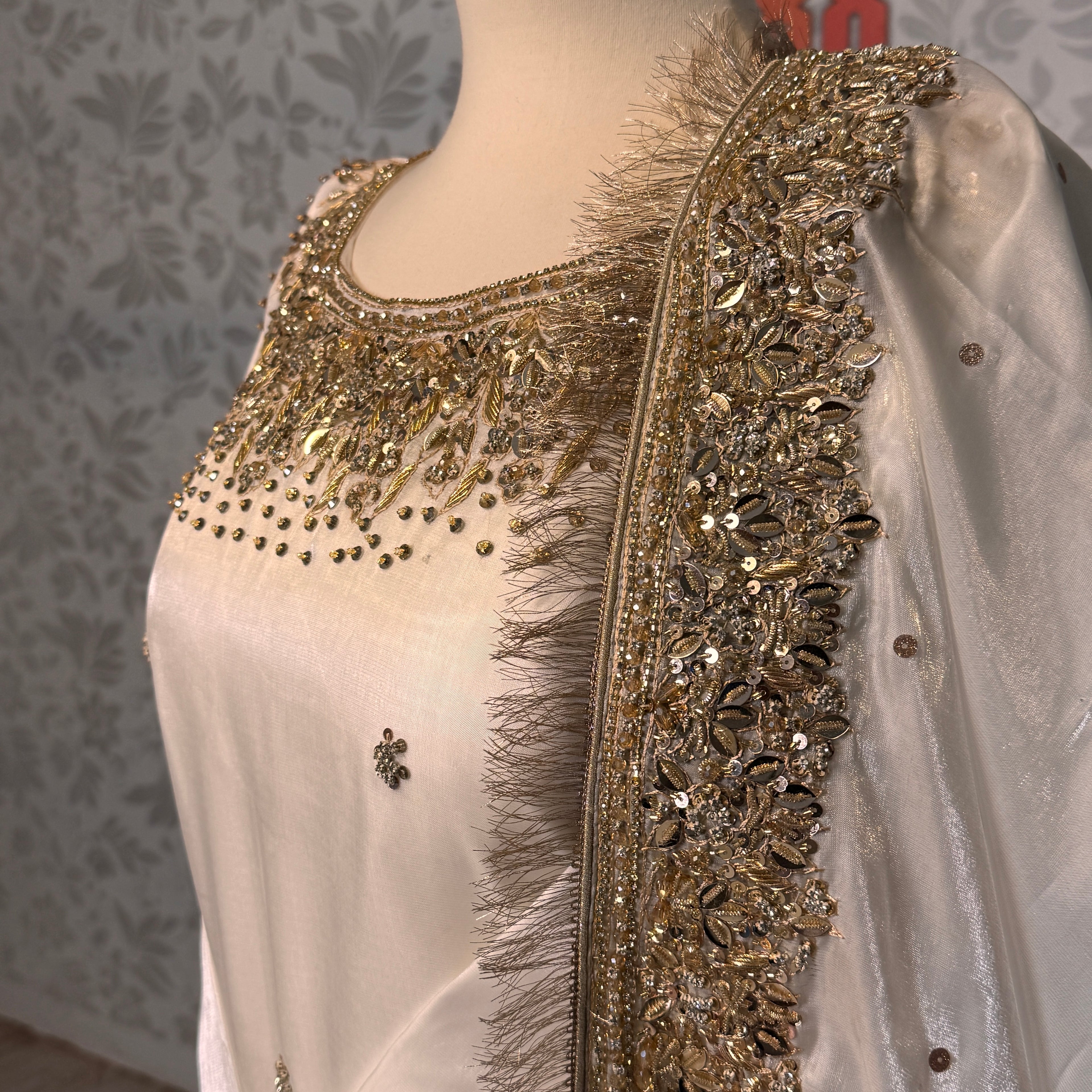 Party wear dresses for girl in Pakistan PW032 shirt close up – kora nakshi sequin hand work detail on off-white sheesha silk fabric
