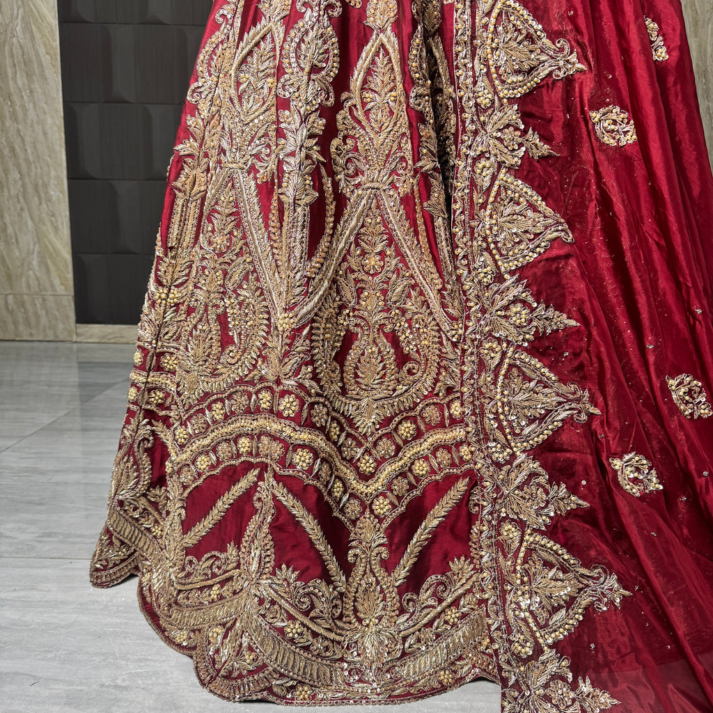2026 bridal lehenga Pakistani BL035 lehenga close up – hand embroidery detail dabka nakshi crystals sequins deep Anari red tissue silk

