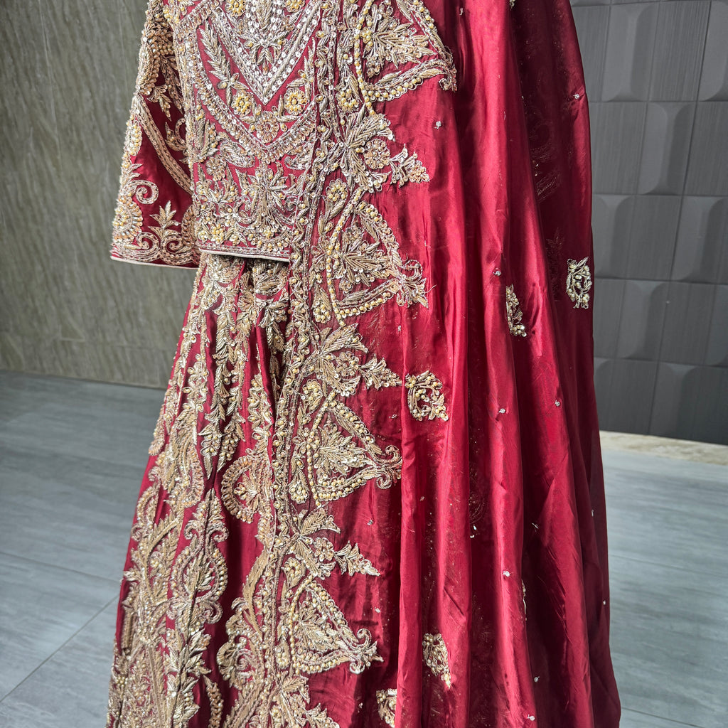 2026 bridal lehenga Pakistani BL035 lehenga close up – hand embroidery detail dabka nakshi crystals sequins deep Anari red tissue silk
