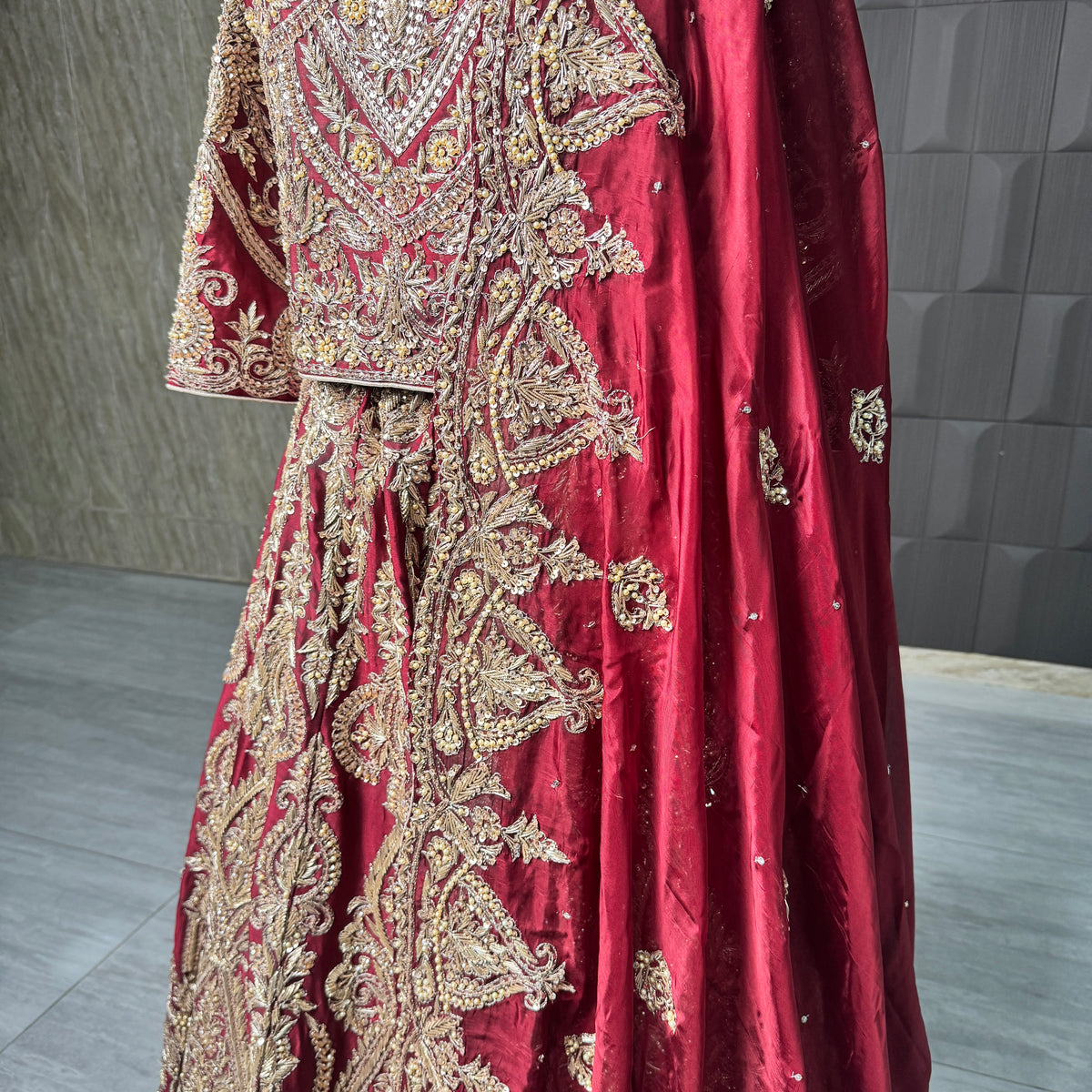 2026 bridal lehenga Pakistani BL035 lehenga close up – hand embroidery detail dabka nakshi crystals sequins deep Anari red tissue silk
