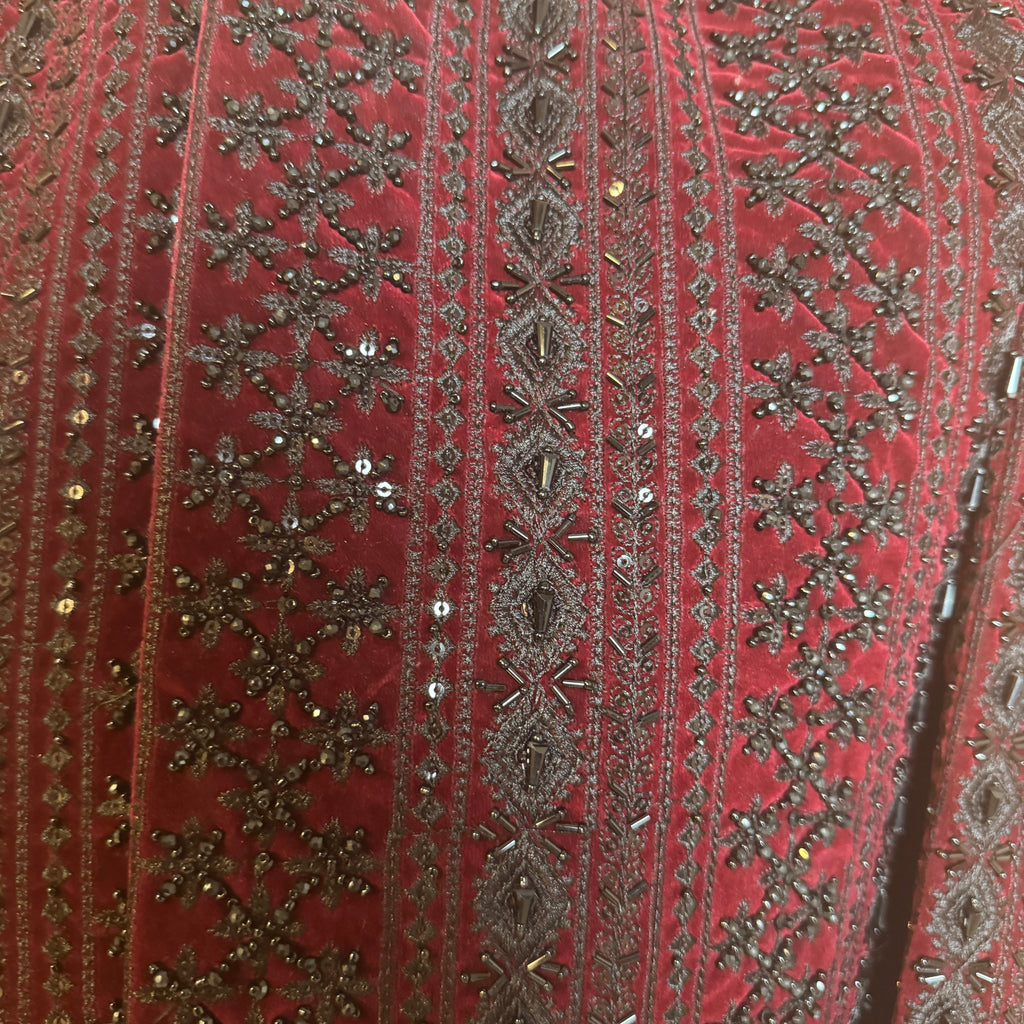 sherwani for men maroon fabric and embroidery texture close-up
