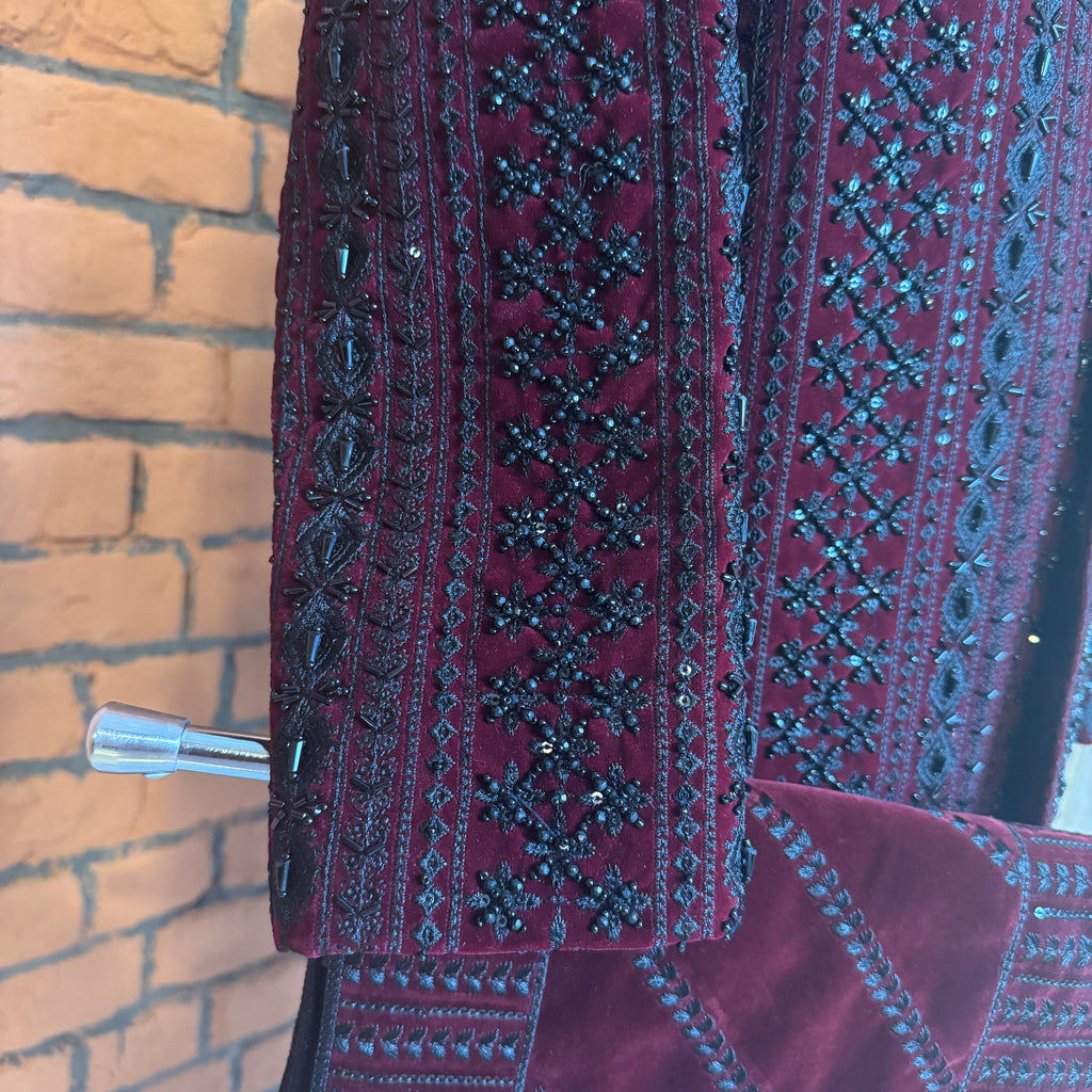 sherwani for men maroon fabric and embroidery texture close-up
