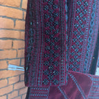 sherwani for men maroon fabric and embroidery texture close-up
