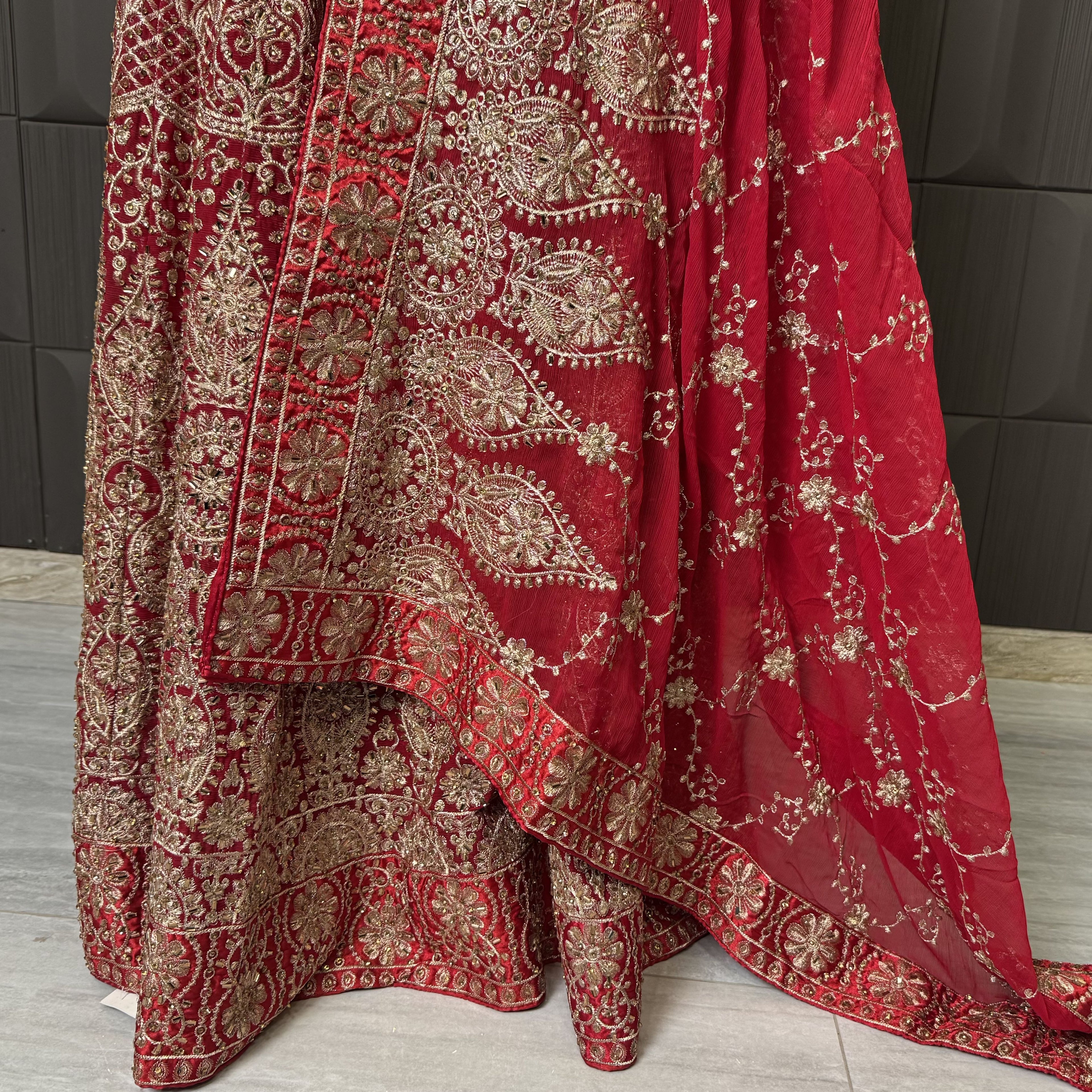 Indian bridal lehenga designs with machine tilla and stone work in deep red