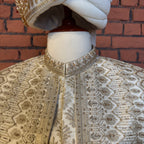 sherwani for groom cream shirt close-up with cutdana embroidery machine work
