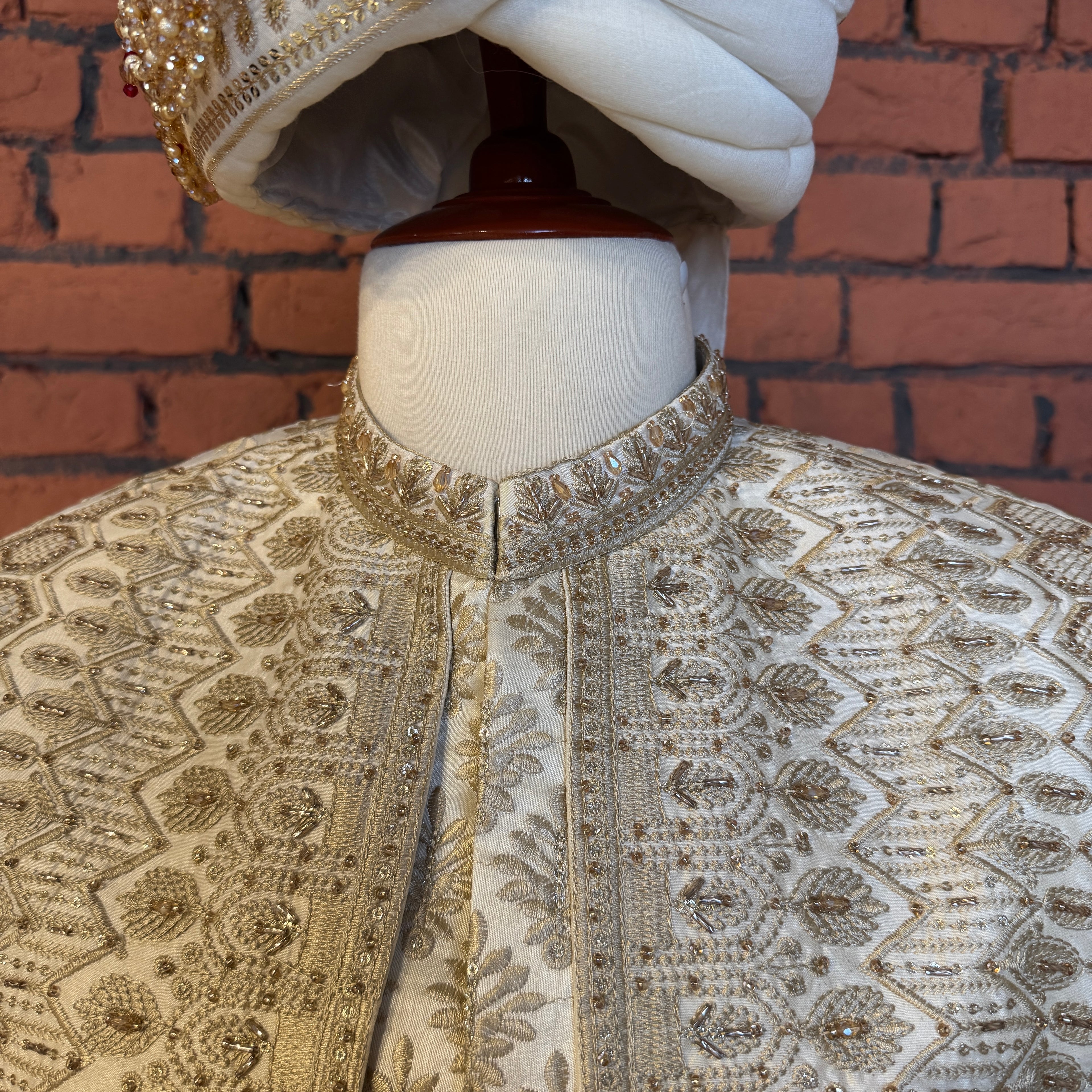 sherwani for groom cream shirt close-up with cutdana embroidery machine work
