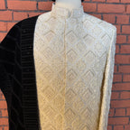 sherwani for groom off white shirt close-up with cutdana and crystal work
