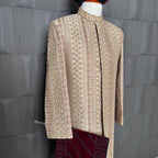sherwani for groom skin gold shirt close-up with cutdana embroidery machine work
