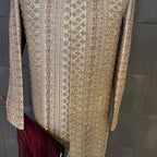 sherwani for men skin gold fabric and embroidery texture close-up
